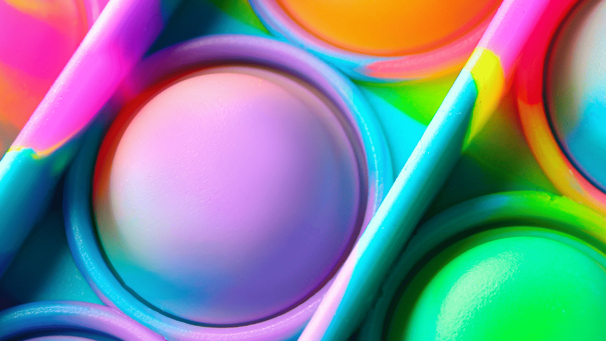 Close up of a rainbow fidget toy.